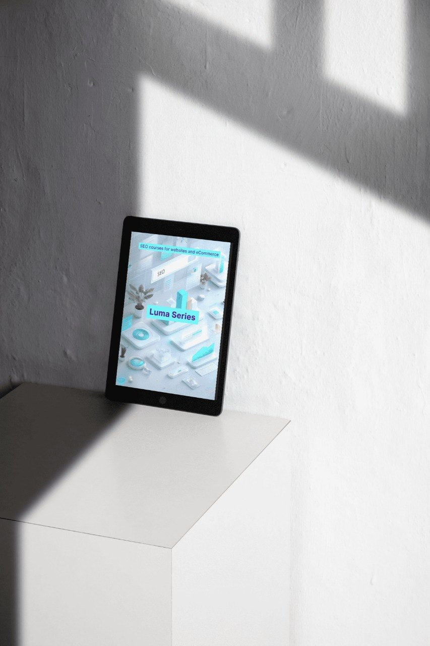 Tablet on a white surface with a gray wall background