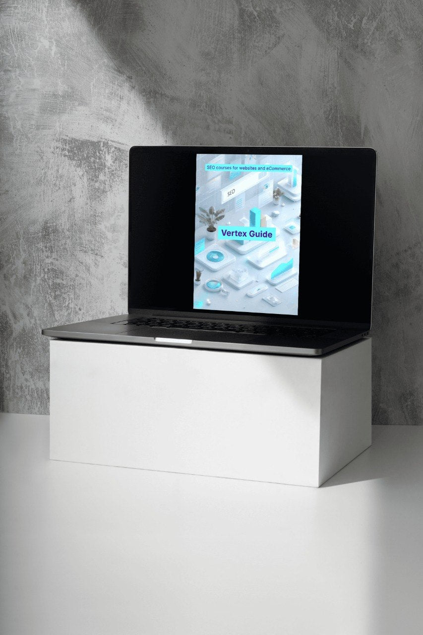 Laptop on a white stand with a gray concrete wall background